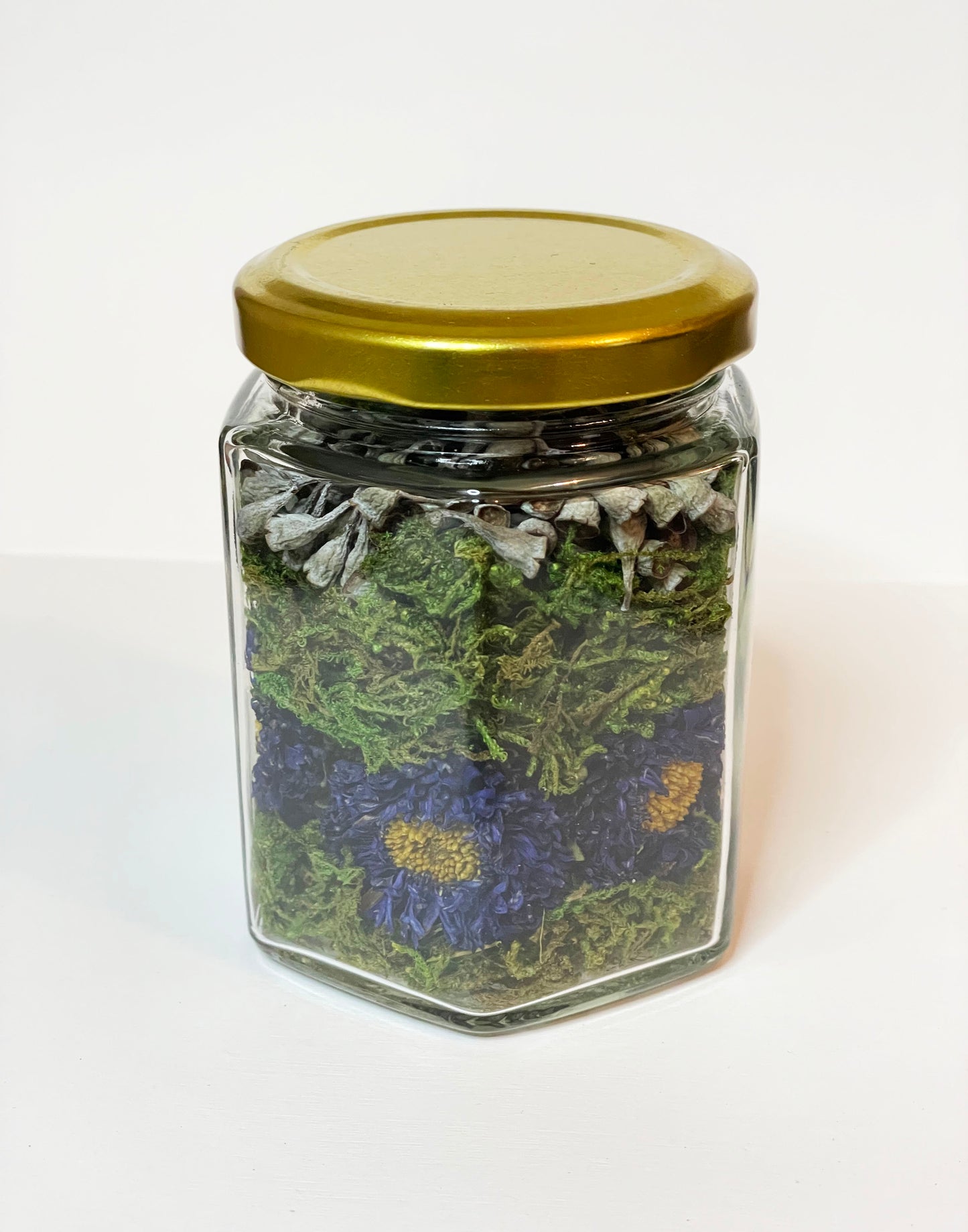 Dried Purple Asters with Seeded Eucalyptus in Honeycomb Shaped Glass Jar with Gold Lid